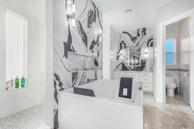 full bathroom featuring visible vents, toilet, a walk in shower, tile walls, and vanity