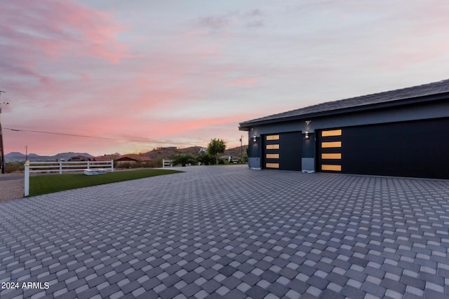 garage featuring decorative driveway