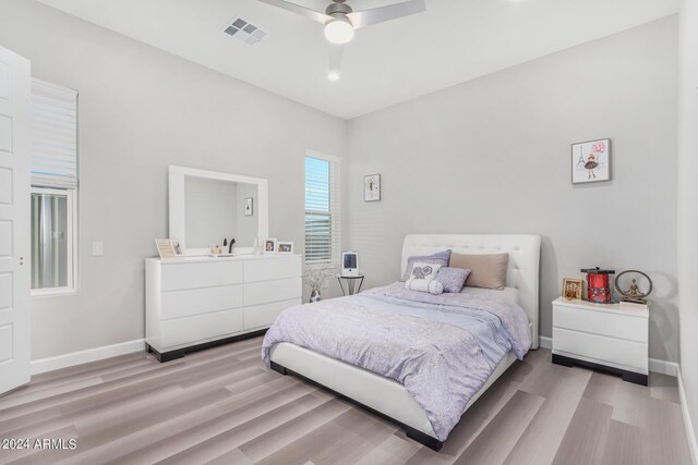 bedroom featuring light wood-type flooring and ceiling fan