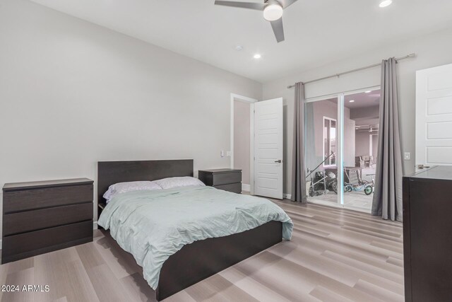 bedroom with light hardwood / wood-style flooring and ceiling fan