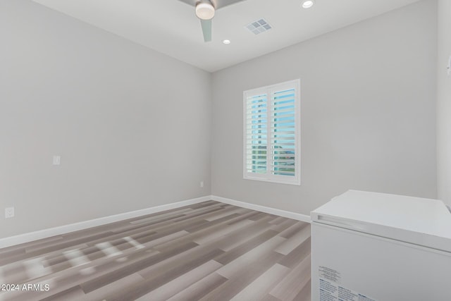 spare room with visible vents, recessed lighting, light wood finished floors, baseboards, and ceiling fan