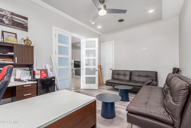 living room with french doors, light wood-type flooring, and ceiling fan