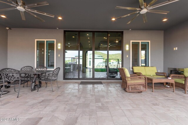 view of patio / terrace with ceiling fan and an outdoor hangout area