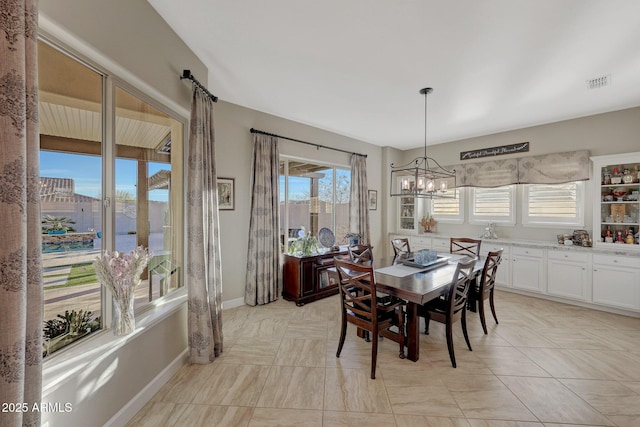 dining room with a notable chandelier