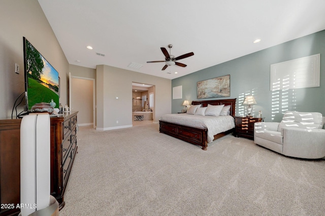 carpeted bedroom with ceiling fan and ensuite bathroom