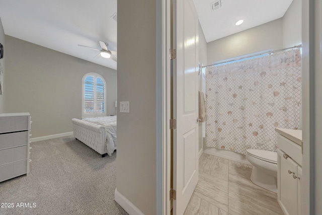 full bathroom with vanity, shower / tub combo, toilet, and ceiling fan