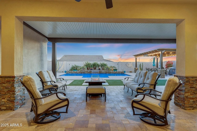 patio terrace at dusk featuring outdoor lounge area, a pergola, and a fenced in pool