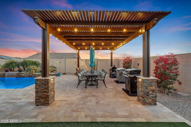 patio terrace at dusk with a pergola