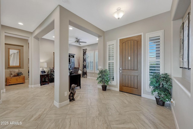 foyer featuring ceiling fan