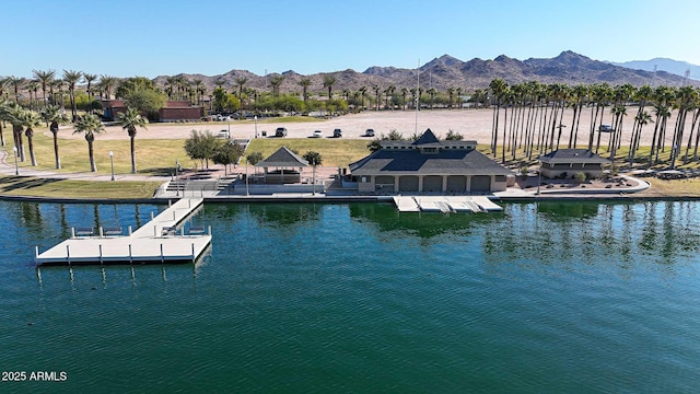 view of dock featuring a water and mountain view