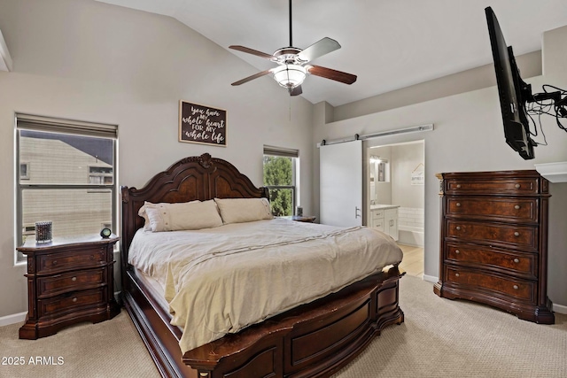 809 W St Moritz Dr, Payson, AZ 85541 - bedroom with baseboards, connected bathroom, a ceiling fan, light carpet, and a barn door