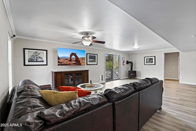 809 W St Moritz Dr, Payson, AZ 85541 - living room with light wood finished floors, baseboards, ornamental molding, a ceiling fan, and a wood stove