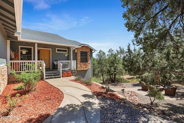 809 W St Moritz Dr, Payson, AZ 85541 - entrance to property with stone siding, covered porch, and roof with shingles