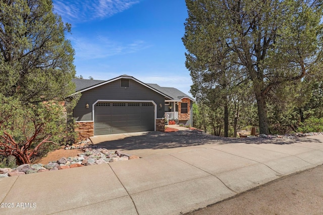 809 W St Moritz Dr, Payson, AZ 85541 - view of property exterior featuring stone siding, driveway, and a garage