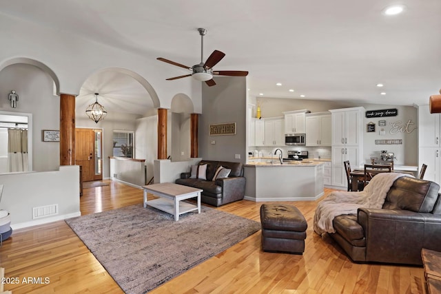 809 W St Moritz Dr, Payson, AZ 85541 - living area with light wood-style floors, a ceiling fan, visible vents, arched walkways, and recessed lighting