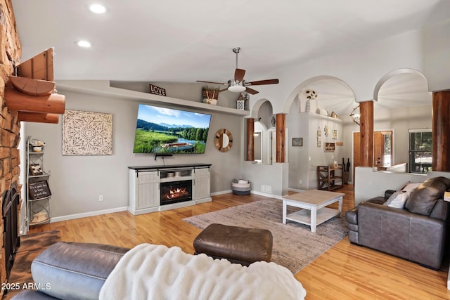 809 W St Moritz Dr, Payson, AZ 85541 - living area featuring a ceiling fan, a glass covered fireplace, vaulted ceiling, and wood finished floors