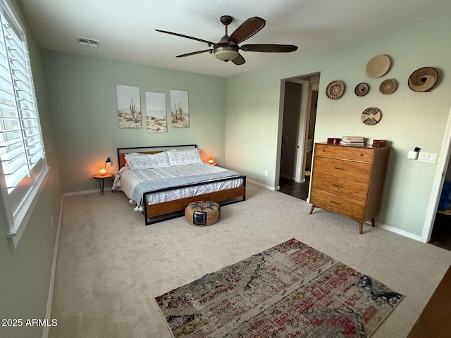 bedroom featuring visible vents, ceiling fan, baseboards, and carpet