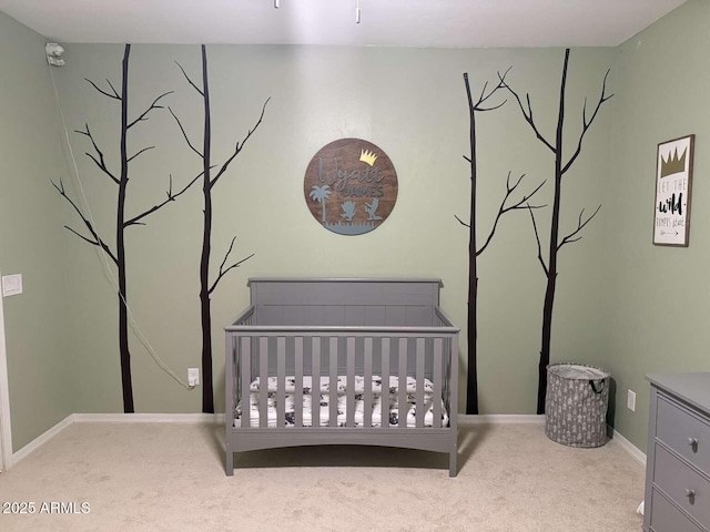 bedroom featuring a crib and carpet floors