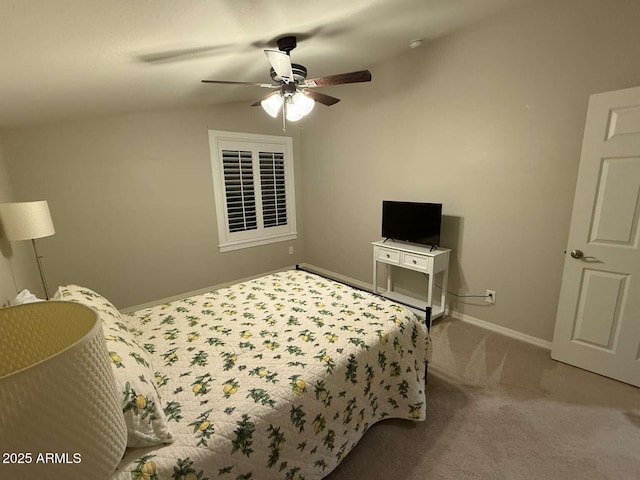 bedroom featuring baseboards, carpet, ceiling fan, and vaulted ceiling