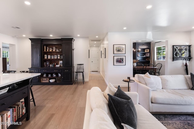 living room with light hardwood / wood-style flooring