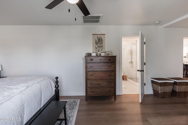 bedroom with dark hardwood / wood-style floors, ceiling fan, and ensuite bathroom