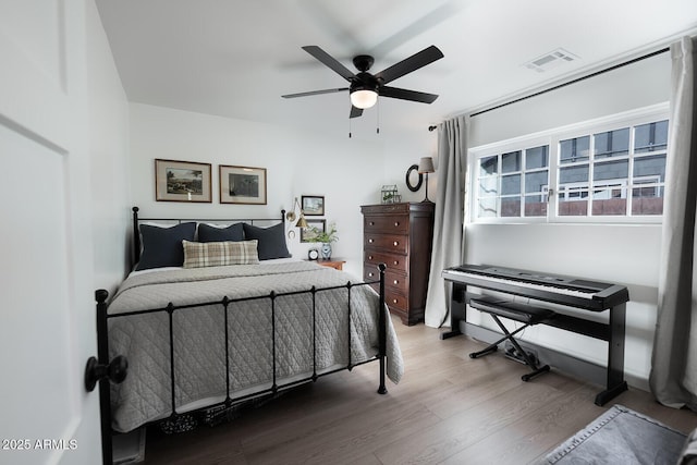 bedroom featuring hardwood / wood-style flooring and ceiling fan