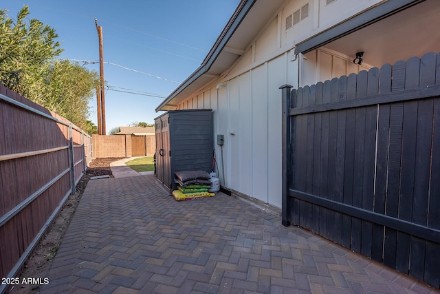 view of side of home with a patio area