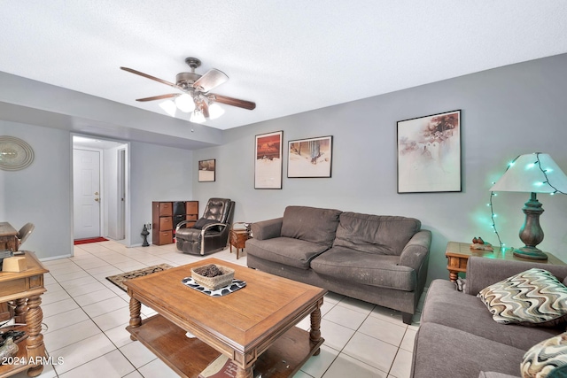 tiled living room with ceiling fan