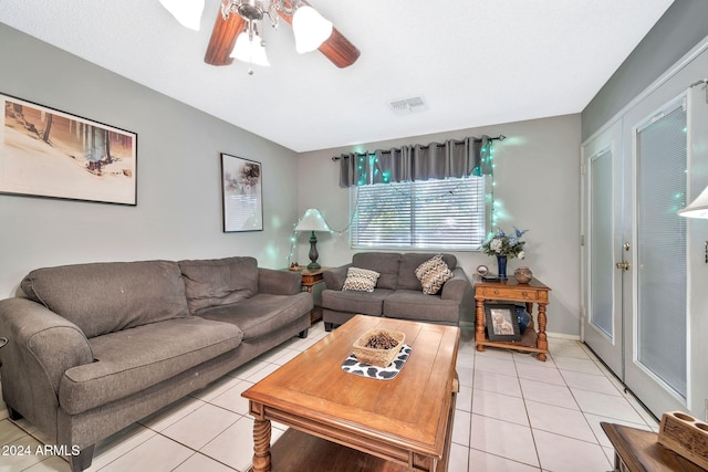 tiled living room featuring ceiling fan