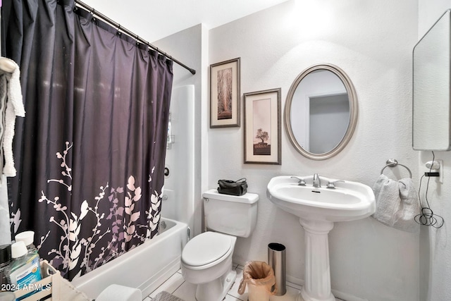 bathroom featuring tile patterned floors, shower / bath combination with curtain, and toilet