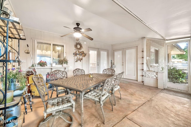 dining space featuring ceiling fan and french doors