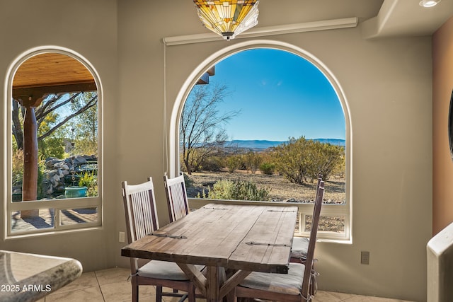 tiled dining area featuring a mountain view