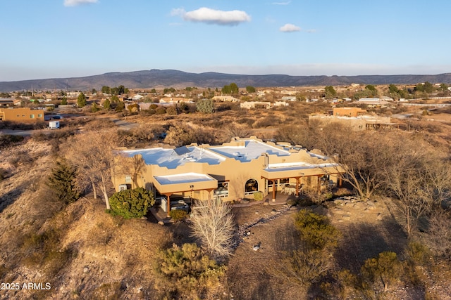 birds eye view of property featuring a mountain view