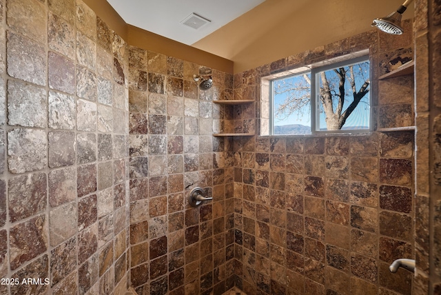 bathroom featuring tiled shower