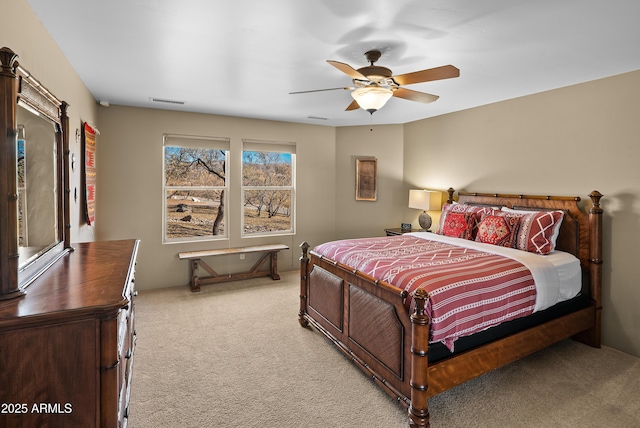 carpeted bedroom featuring ceiling fan