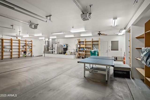 garage featuring ceiling fan, water heater, and a garage door opener