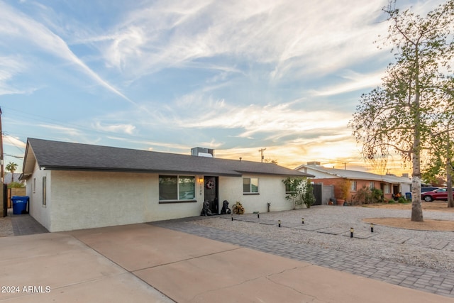 ranch-style home featuring a patio