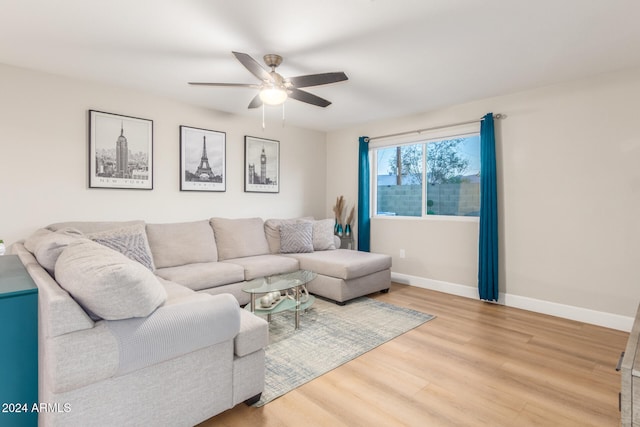 living room featuring light wood-type flooring and ceiling fan