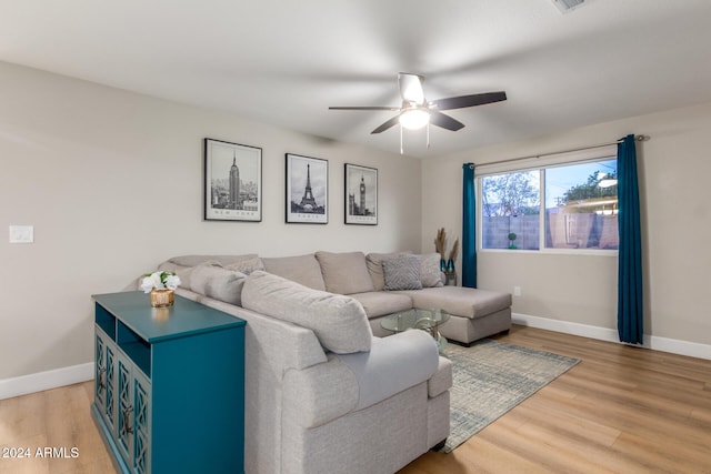 living room with ceiling fan and wood-type flooring