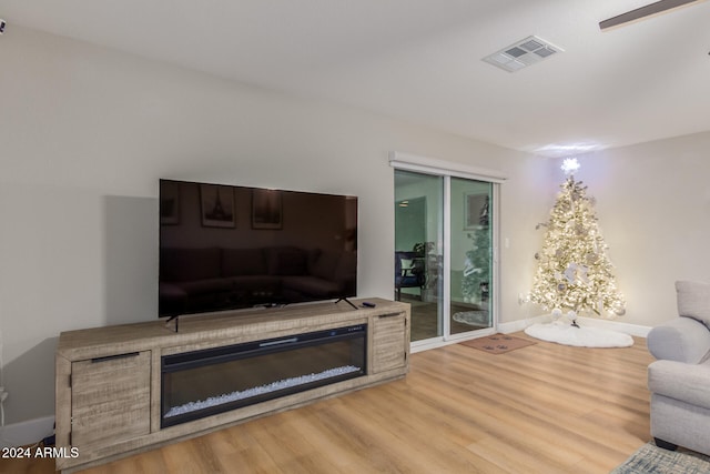 living room with light hardwood / wood-style floors