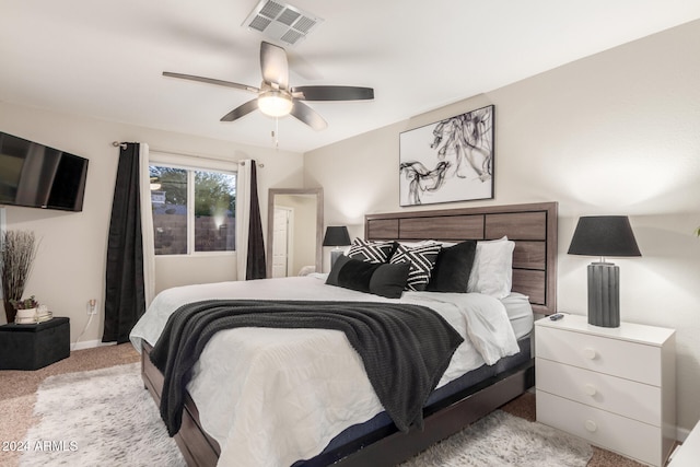 carpeted bedroom with ceiling fan