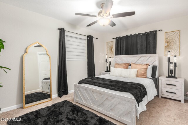 bedroom with light colored carpet and ceiling fan