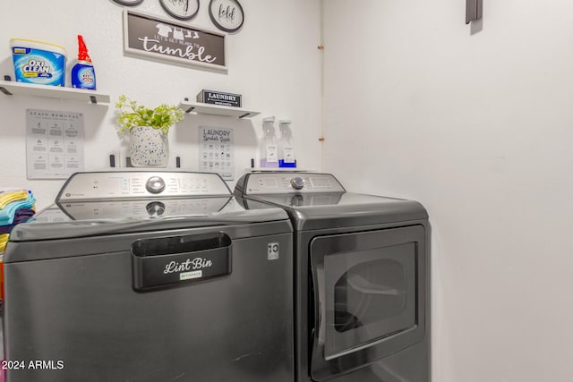 clothes washing area with separate washer and dryer