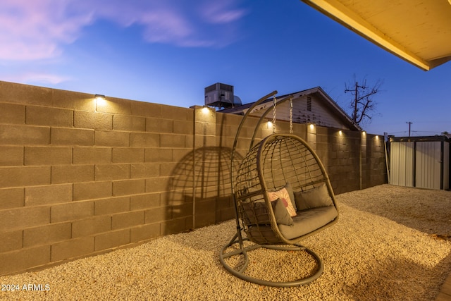 view of patio terrace at dusk