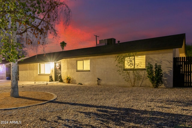 view of back house at dusk