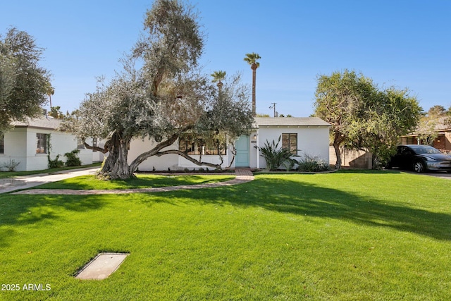 view of front of home with a front lawn