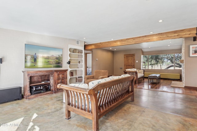 living room with recessed lighting, a fireplace, and beamed ceiling