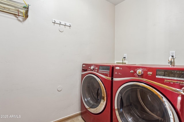 laundry room with laundry area and washing machine and clothes dryer