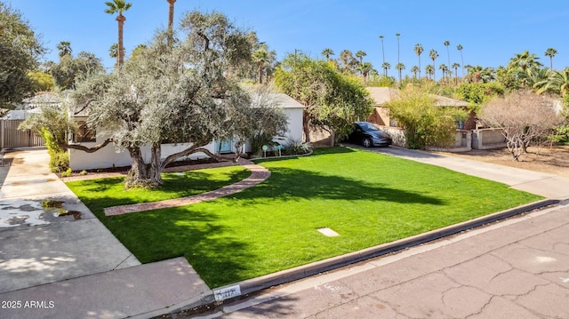 exterior space with driveway and fence