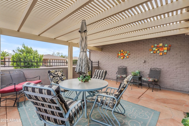 view of patio featuring outdoor dining area and a pergola